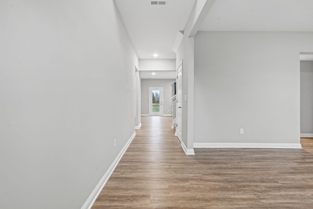 hall with light wood-type flooring