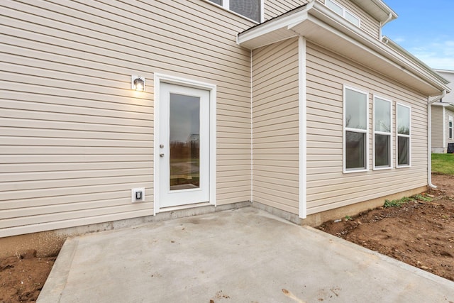 doorway to property featuring a patio area