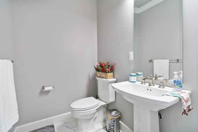 bathroom with toilet and sink