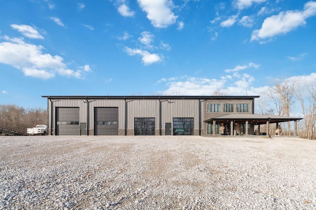 exterior space with a garage and an outdoor structure