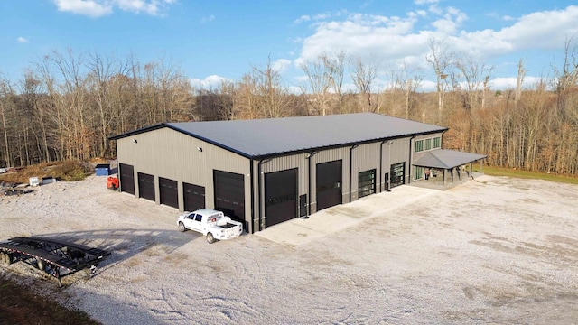 view of side of property with an outbuilding and a garage