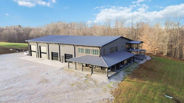 back of property with an outbuilding and a garage