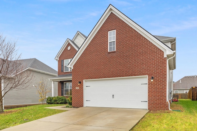 view of front property with a garage and a front yard