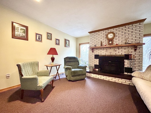 living room with carpet flooring, a healthy amount of sunlight, and a brick fireplace