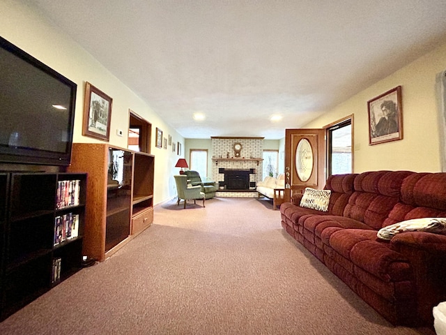 carpeted living room featuring a brick fireplace