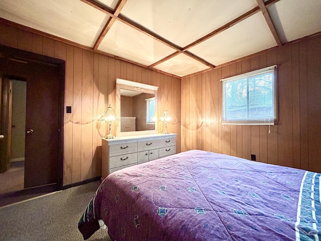 bedroom featuring carpet flooring and wooden walls