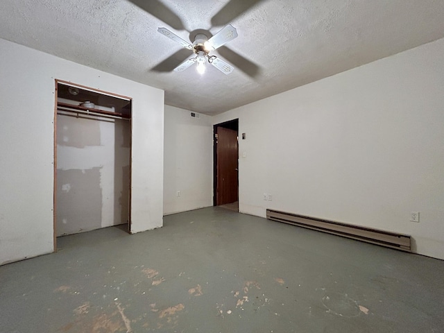 unfurnished bedroom featuring ceiling fan, concrete floors, a textured ceiling, and a baseboard radiator