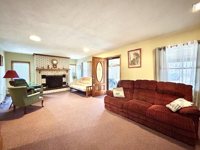 carpeted living room featuring a fireplace and a textured ceiling