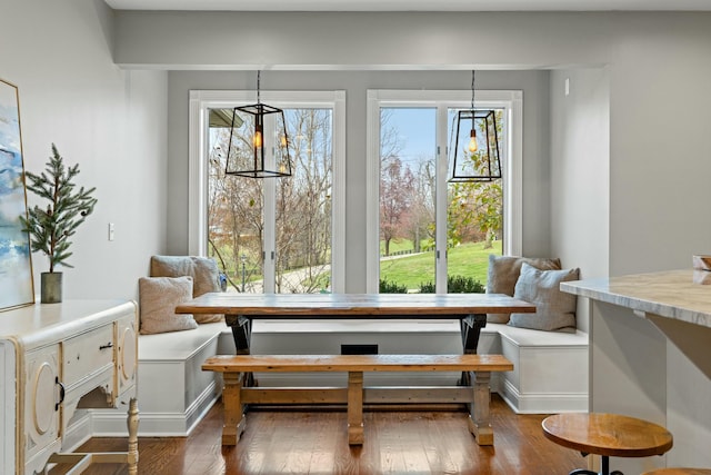 dining space featuring a chandelier, dark hardwood / wood-style flooring, and breakfast area