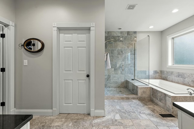 bathroom with vanity and plus walk in shower