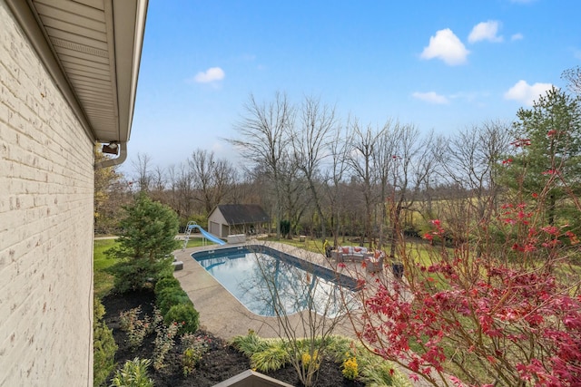 view of pool featuring a water slide