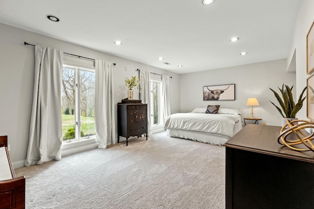 bedroom featuring light colored carpet