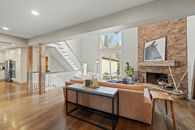 living room with a fireplace and hardwood / wood-style flooring