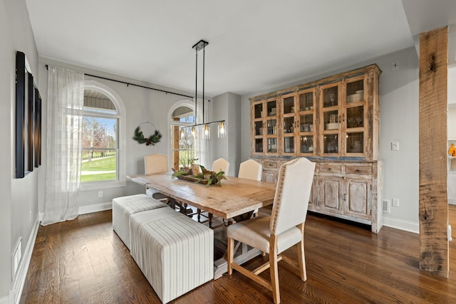 dining area with dark hardwood / wood-style floors