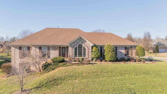 ranch-style home with a front yard