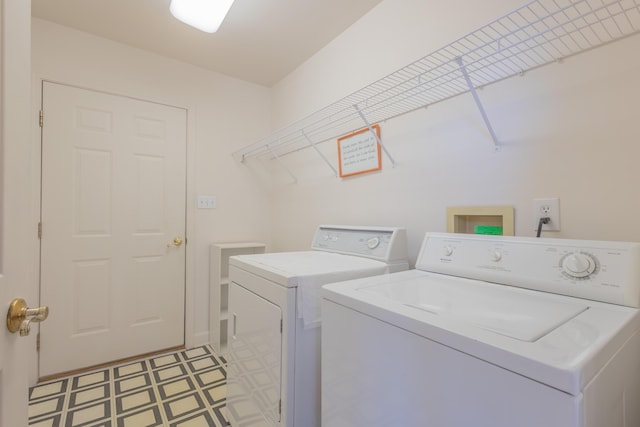 laundry area with washing machine and dryer