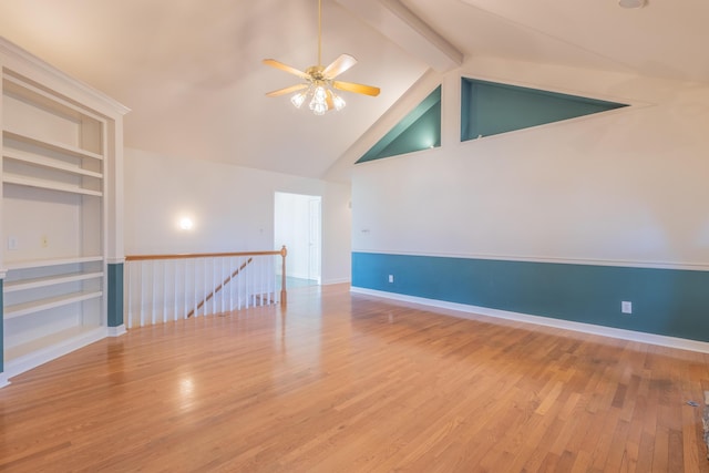 unfurnished room with hardwood / wood-style flooring, ceiling fan, beamed ceiling, and high vaulted ceiling