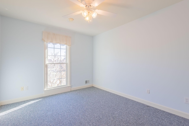 spare room with carpet and ceiling fan