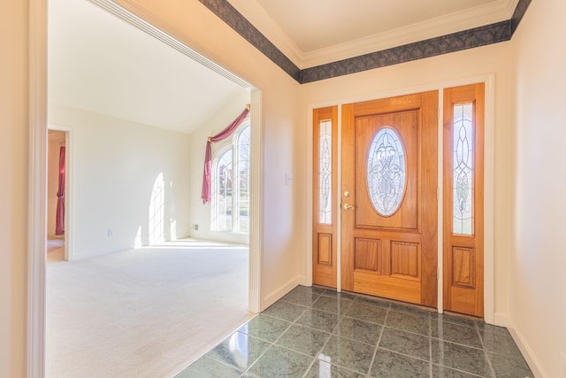 foyer entrance featuring dark carpet and crown molding