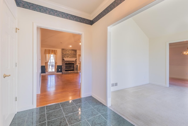 corridor with crown molding and dark wood-type flooring