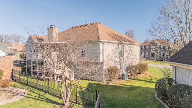 view of side of home featuring a yard