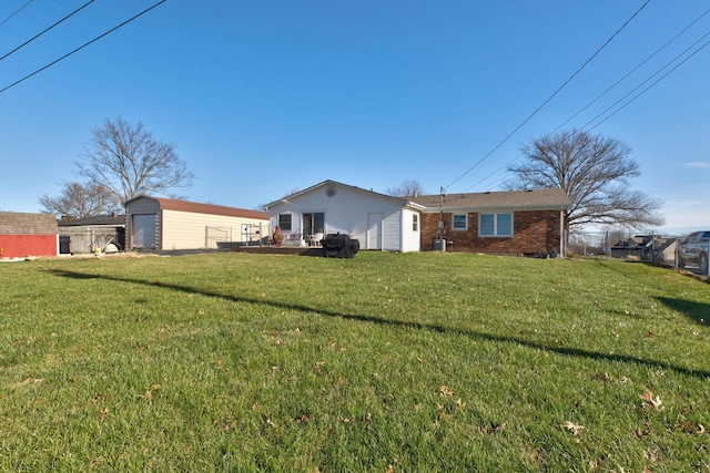 back of house with a yard