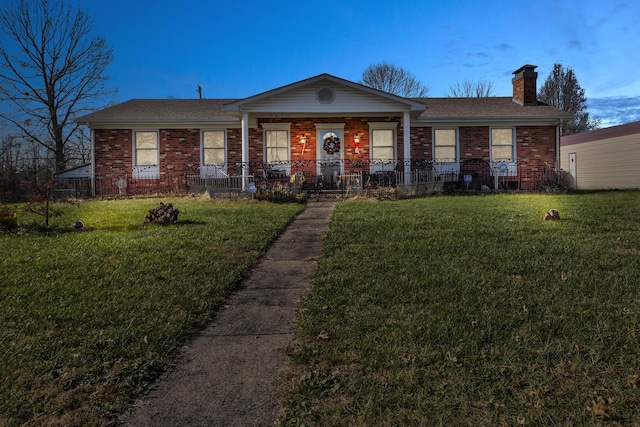 ranch-style house with a front lawn