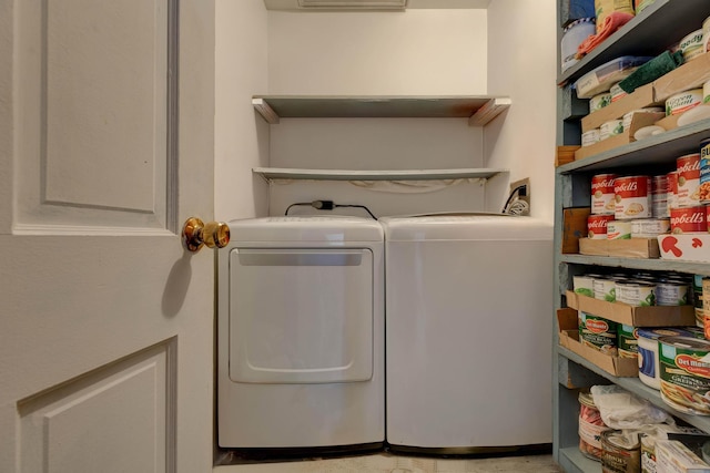 washroom with washing machine and dryer