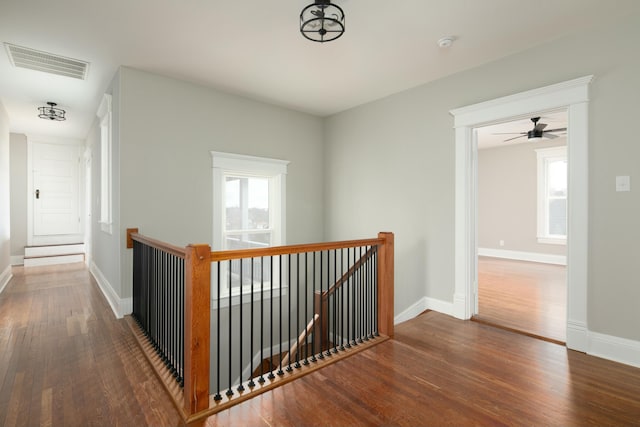 corridor featuring dark hardwood / wood-style flooring