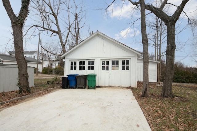 rear view of house with an outbuilding and a garage