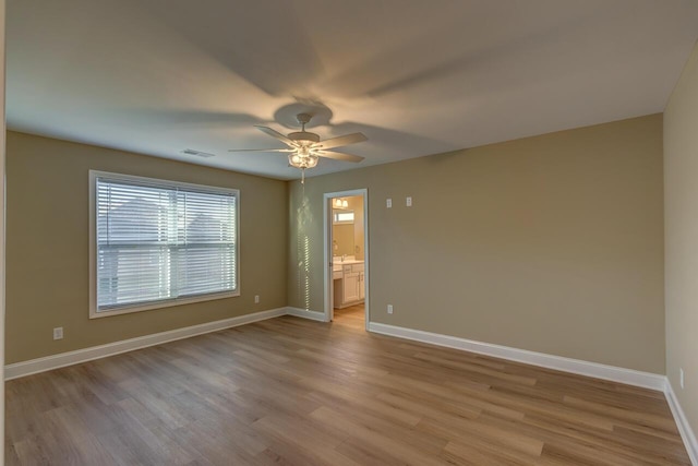 spare room with ceiling fan and light hardwood / wood-style flooring