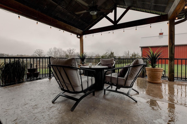 view of patio / terrace featuring ceiling fan