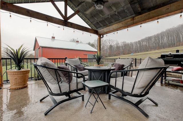 view of patio featuring ceiling fan