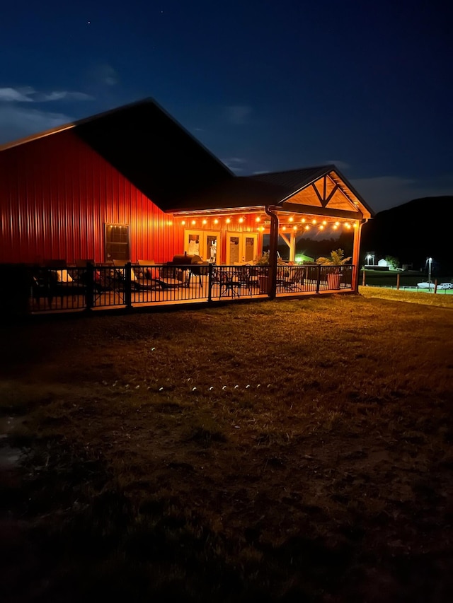 view of back house at twilight