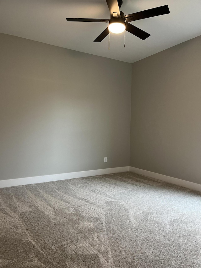 spare room with carpet flooring and ceiling fan