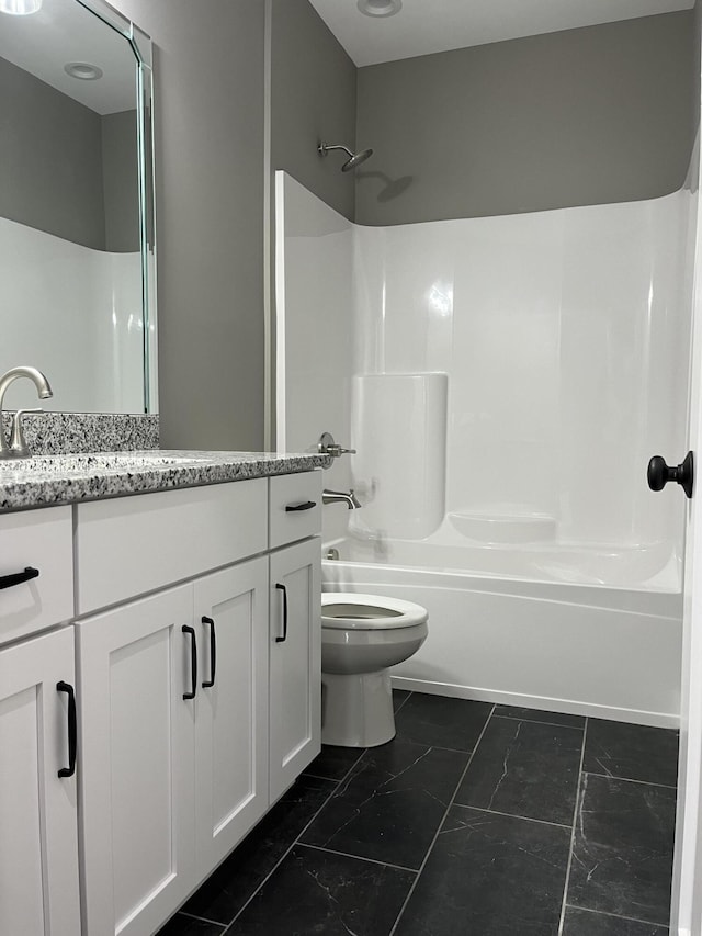 full bathroom with vanity, shower / bathtub combination, and toilet