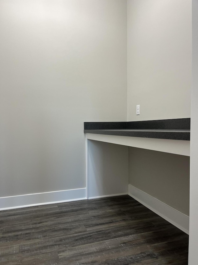 empty room featuring dark hardwood / wood-style flooring