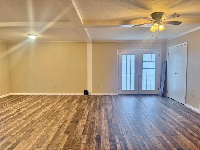 spare room featuring coffered ceiling, french doors, ceiling fan, ornamental molding, and dark hardwood / wood-style flooring