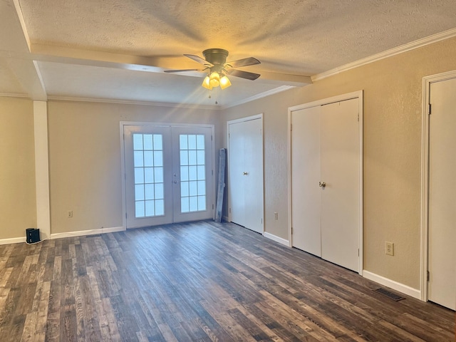 unfurnished bedroom featuring a textured ceiling, ceiling fan, and dark wood-type flooring