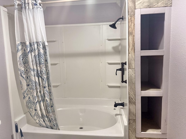 bathroom with shower / tub combo with curtain and built in features