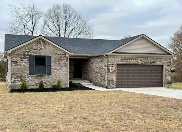 ranch-style home with a garage and a front lawn