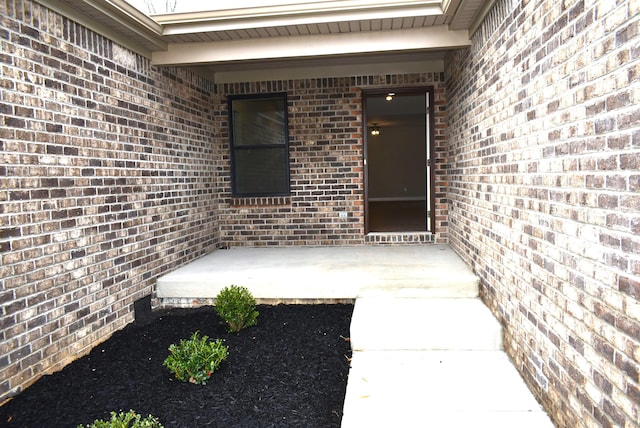 entrance to property with a patio