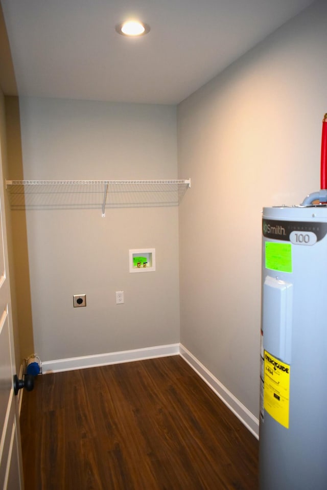 washroom with electric water heater, hookup for a washing machine, dark wood-type flooring, and hookup for an electric dryer