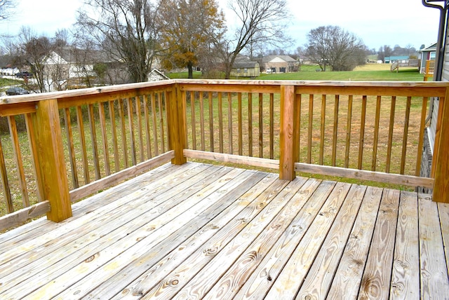 wooden deck with a yard