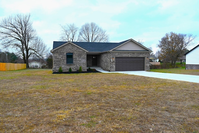 view of front of property with a front lawn and a garage