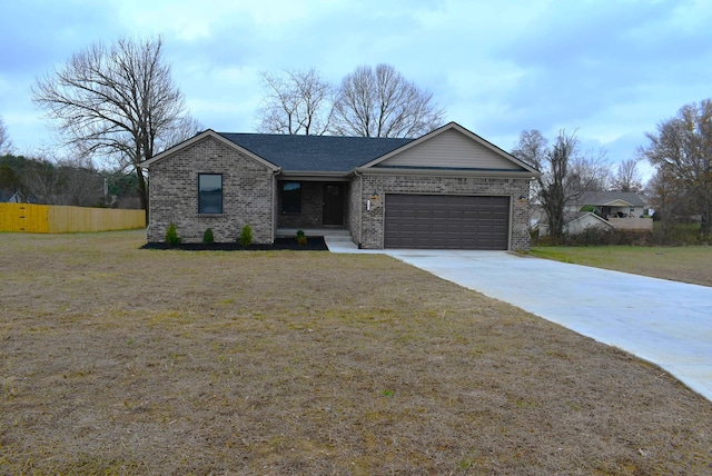 ranch-style home with a front lawn and a garage