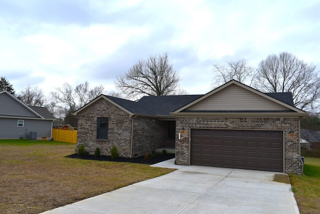 ranch-style house featuring a garage and a front lawn