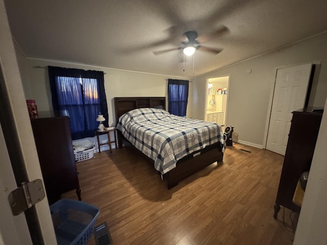 bathroom with vanity, a textured ceiling, hardwood / wood-style flooring, and walk in shower