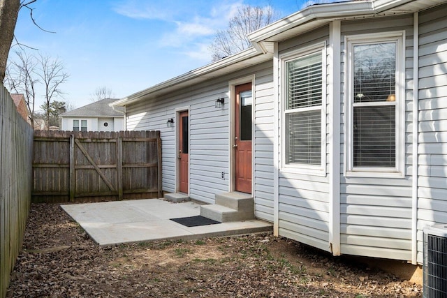 exterior space featuring cooling unit and fence