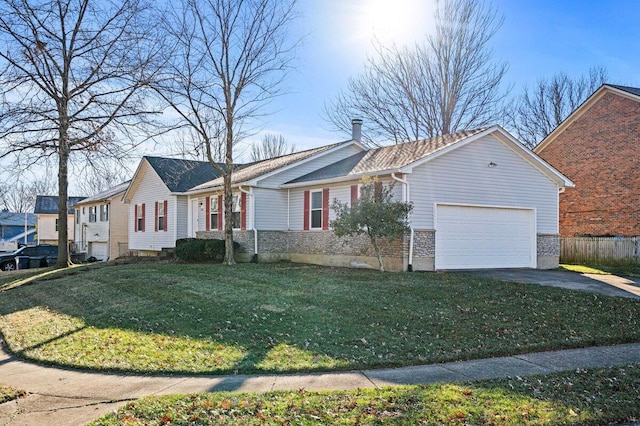 single story home featuring a front lawn, fence, a garage, and driveway